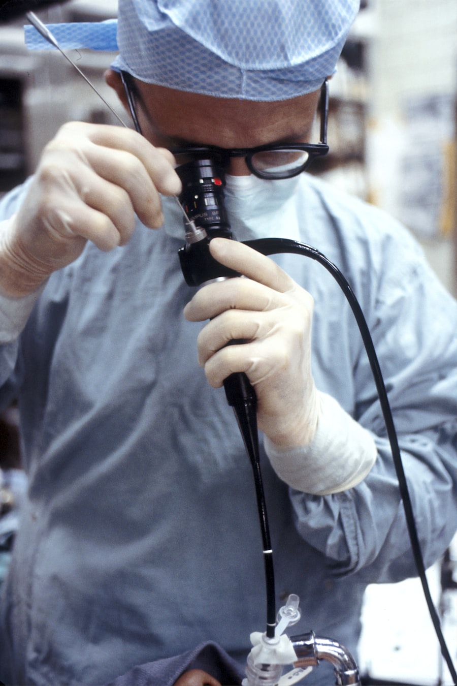 Doctor holding a corded endoscope device used during an endoscopy procedure